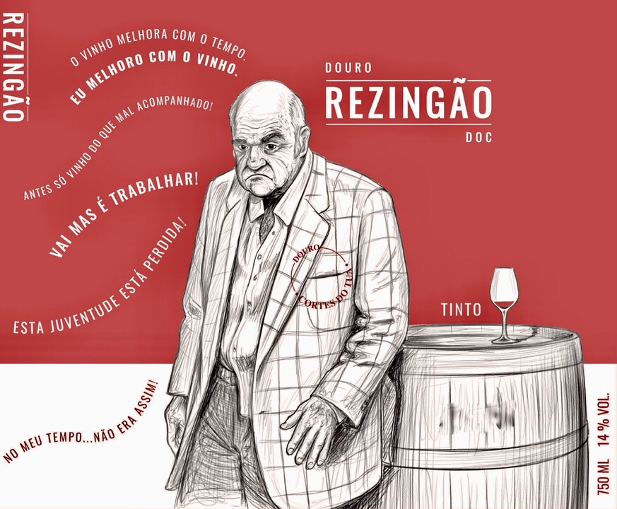 Wine label showing an old man standing next to a wine barrel.